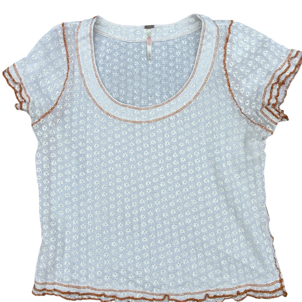 An extremely cute top with a pretty pattern and soft frills.